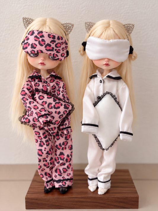 Handmade satin pajama sets for Blythe dolls in pink leopard and black and white with pillows and sleep masks